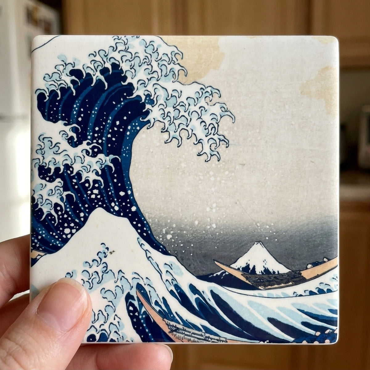 Great Wave ceramic coasters set of 4, in hand