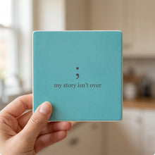 Mental Health Semicolon ceramic coasters set of 4, in hand