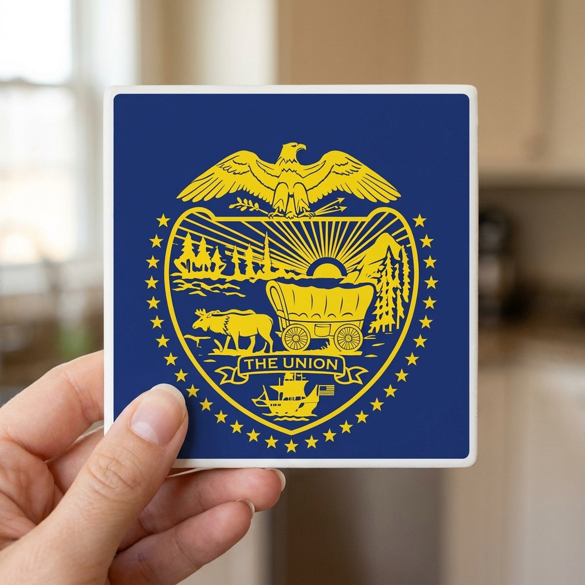 Oregon State Flag ceramic coasters set of 4, in hand
