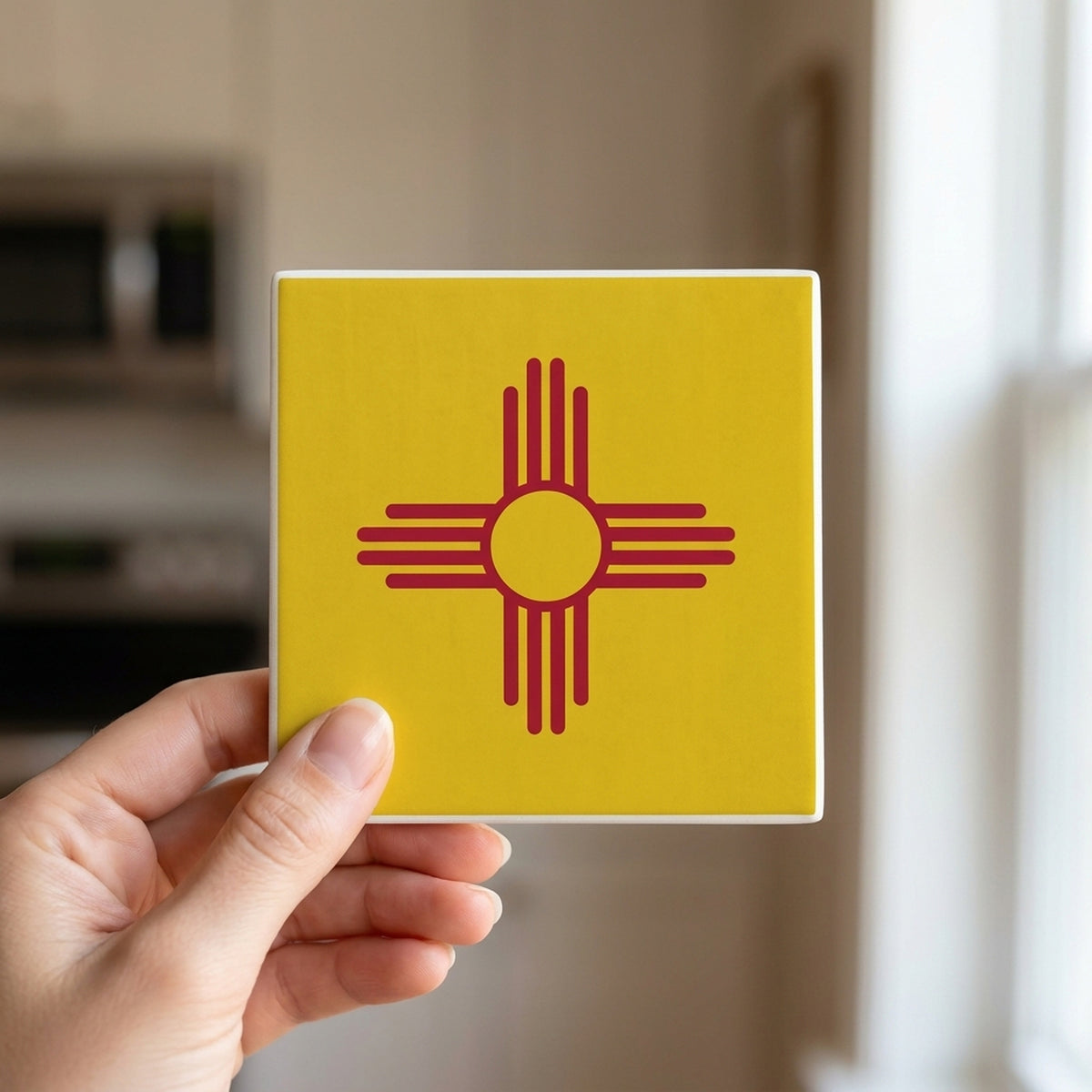 New Mexico State Flag ceramic coasters set of 4, in hand