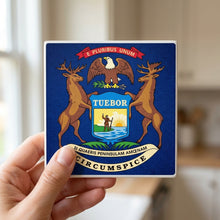 Michigan State Flag ceramic coasters set of 4, in hand