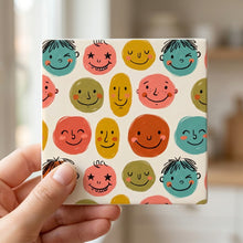Smiley Face ceramic coasters set of 4, in hand