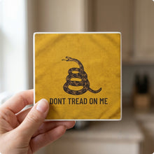 Don't Tread On Me ceramic coasters set of 4, in hand