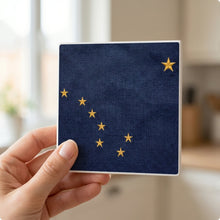 Alaska State Flag ceramic coasters set of 4, in hand