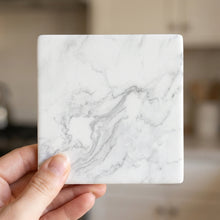 White Marble ceramic coasters set of 4, in hand
