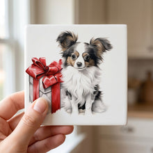 Papillon Puppy Drawing ceramic coasters set of 4, in hand