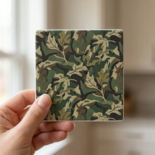 Green Camo ceramic coasters set of 4, in hand