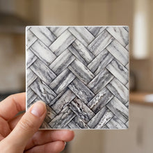 Herringbone ceramic coasters set of 4, in hand