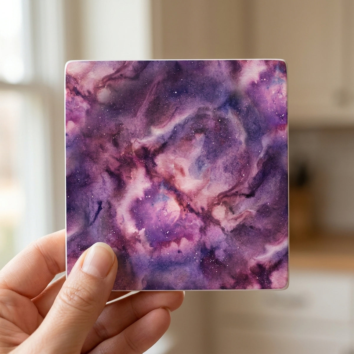 Galaxy Nebula ceramic coasters set of 4, in hand