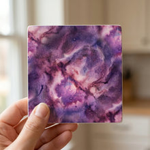 Galaxy Nebula ceramic coasters set of 4, in hand