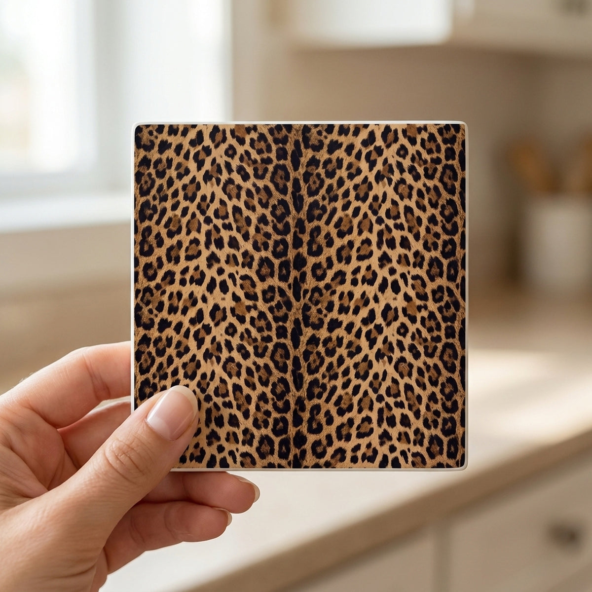 Leopard Print ceramic coasters set of 4, in hand