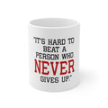 Glossy White Coffee / Tea Mug - It's Hard to Beat a Person Who Never Gives Up
