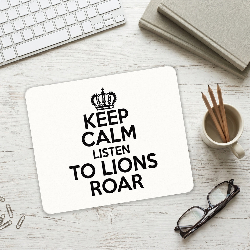 Keep Calm Listen to Lions Roar mouse pad on a desk with a keyboard