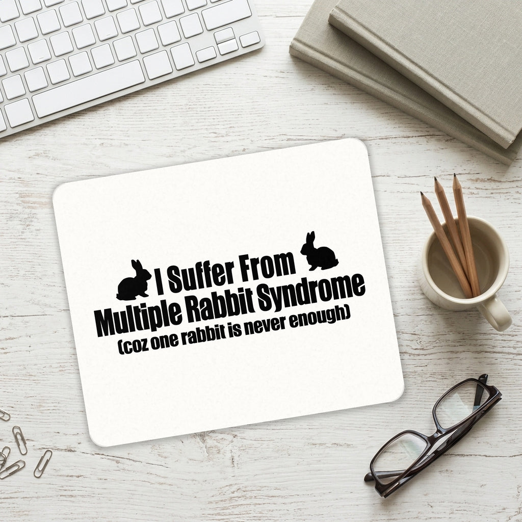I Suffer From Multiple Rabbit Syndrome mouse pad on a desk with a keyboard