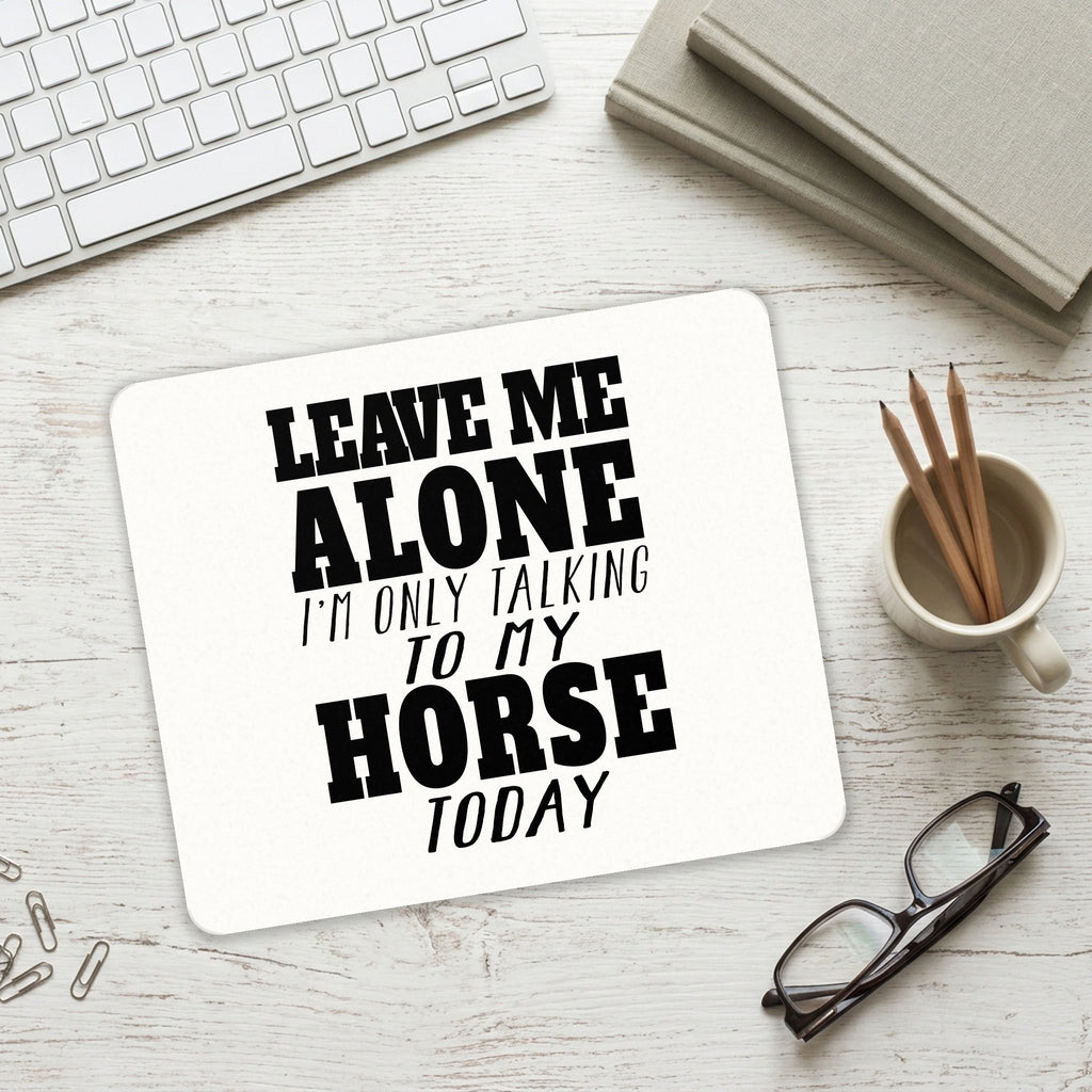 Leave Me Alone I'm Only Talking to Horse mouse pad on a desk with a keyboard