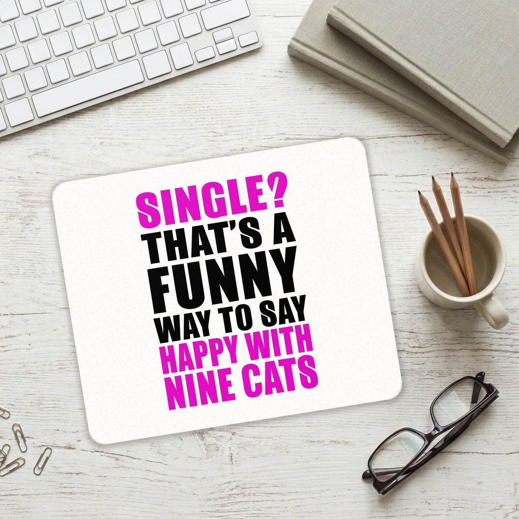 Single? Happy with Nine Cats mouse pad on a desk with a keyboard