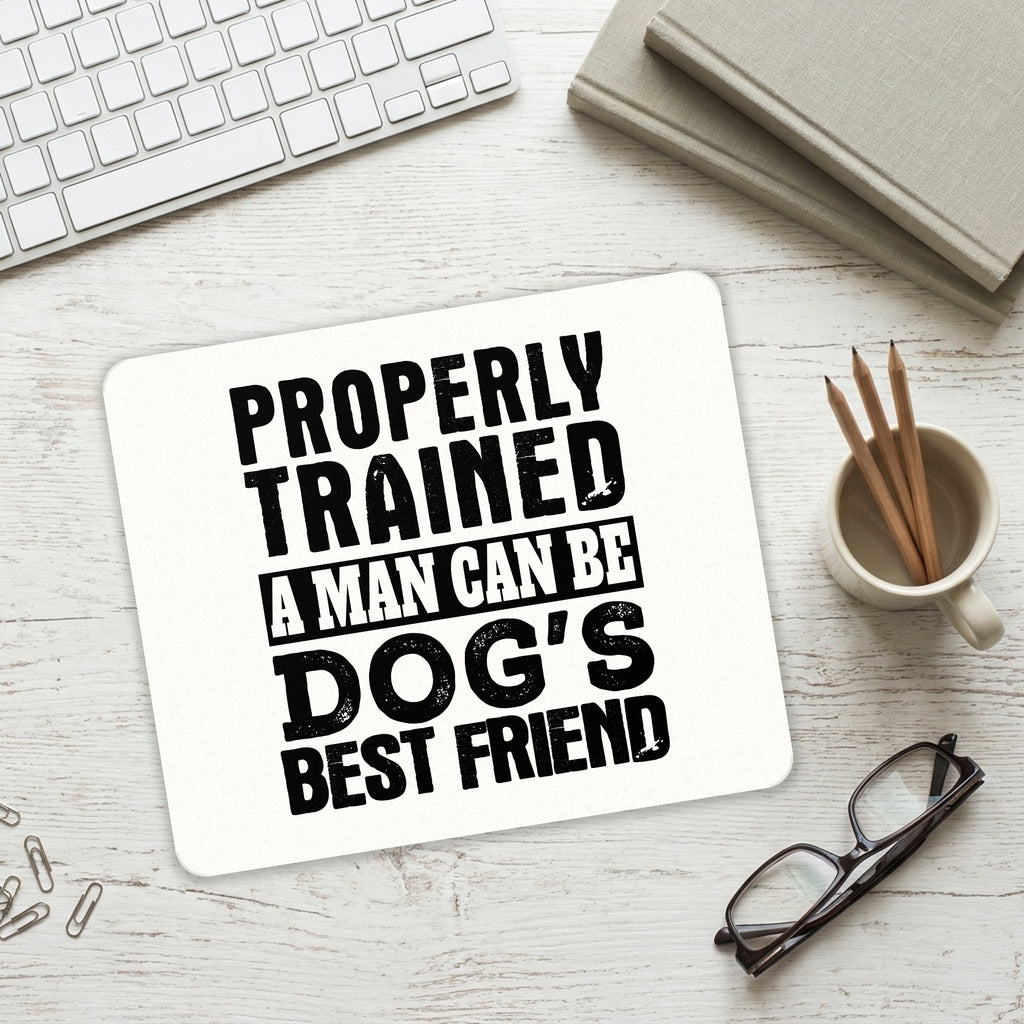Properly Trained Man Dog's Best Friend mouse pad on a desk with a keyboard