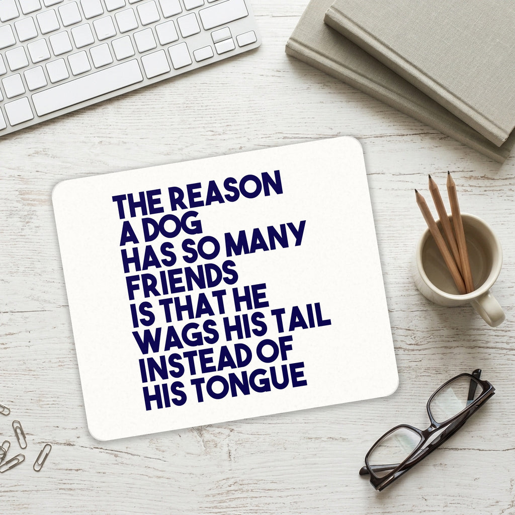 Dog Wags Tail Instead of Tongue mouse pad on a desk with a keyboard