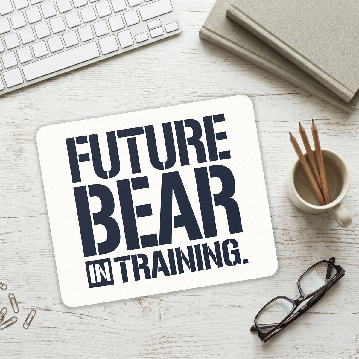 Future Bear in Training mouse pad on a desk with a keyboard