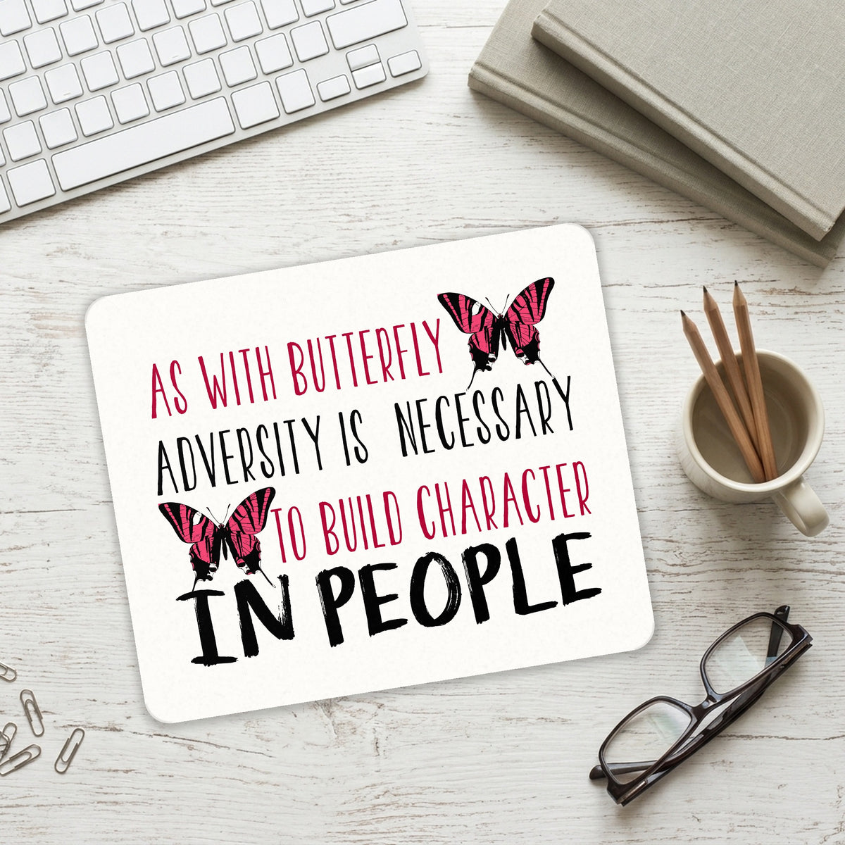 Butterfly - Adversity Necessary Build Character mouse pad on a desk with a keyboard