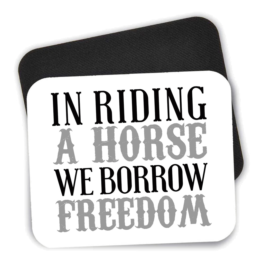 In Riding a Horse, We Borrow Freedom mouse pad shown with its black non-slip rubber underside