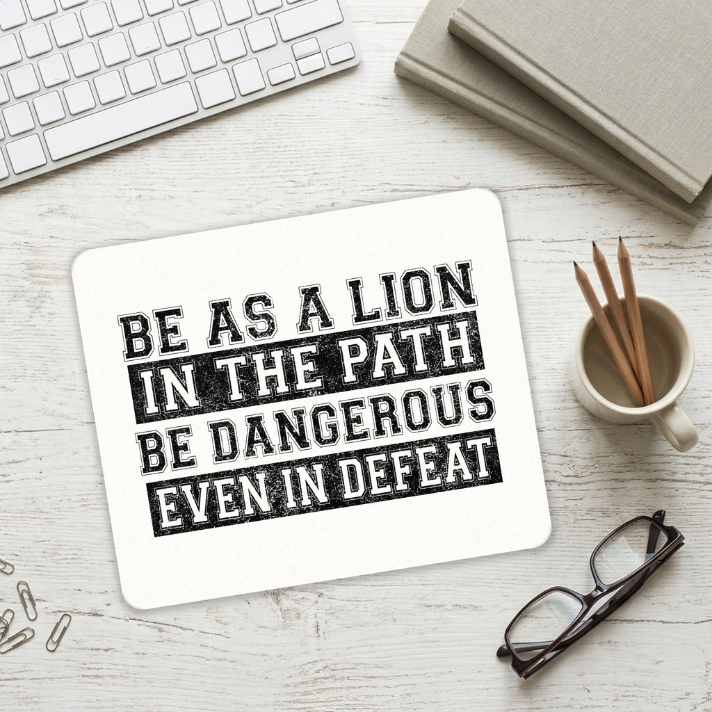 Be As A Lion - Dangerous in Defeat mouse pad on a desk with a keyboard