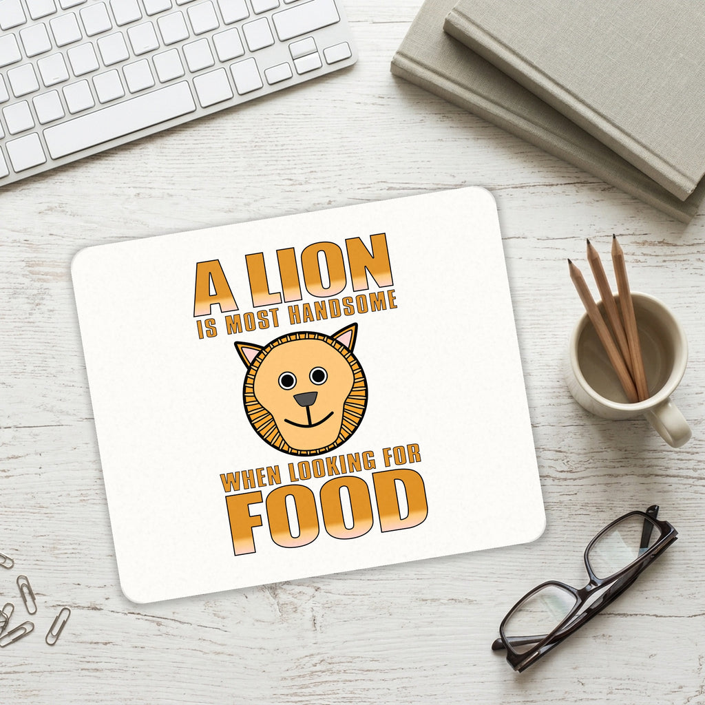 Lion is Most Handsome When Looking for Food mouse pad on a desk with a keyboard