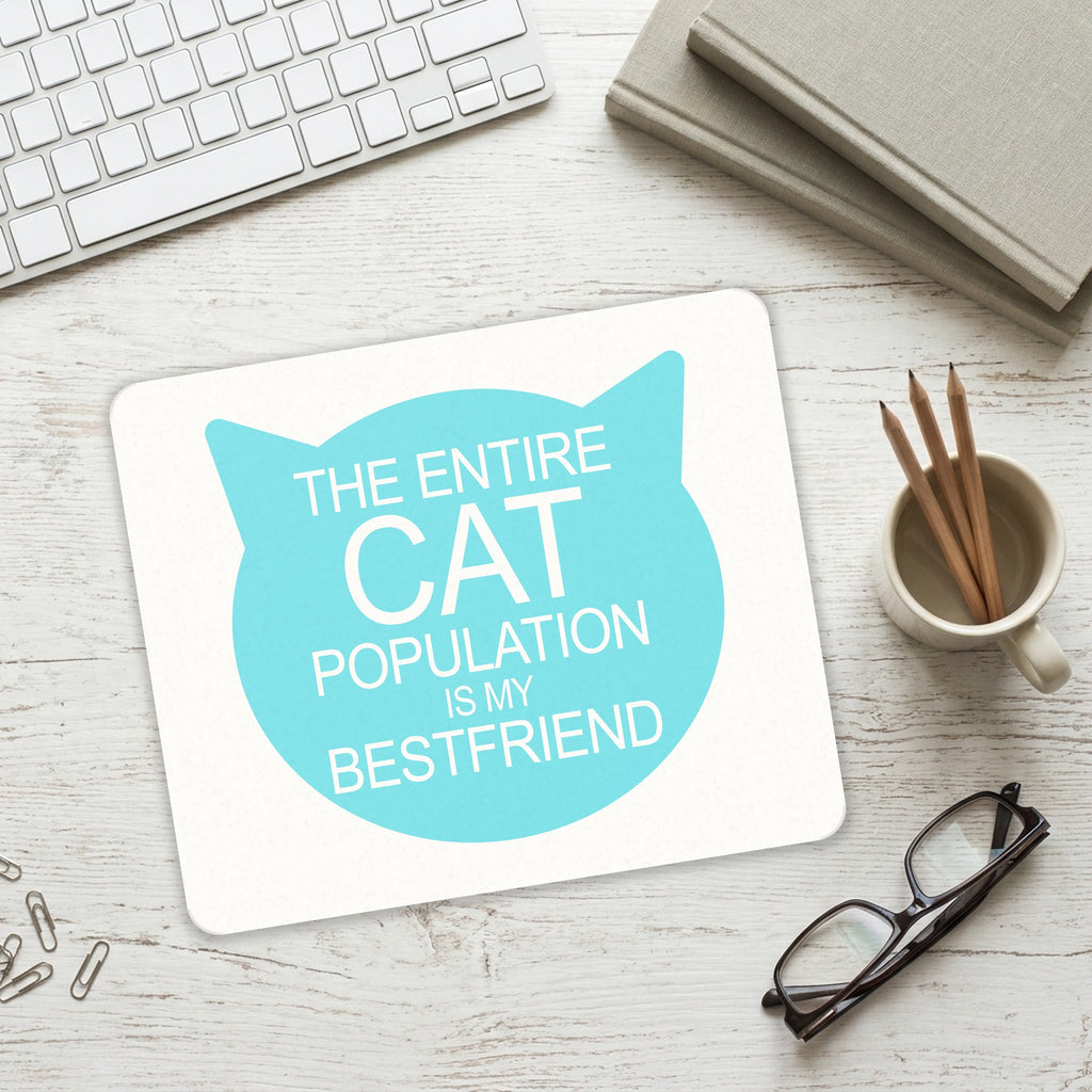 Cat Population is My Best Friend mouse pad on a desk with a keyboard