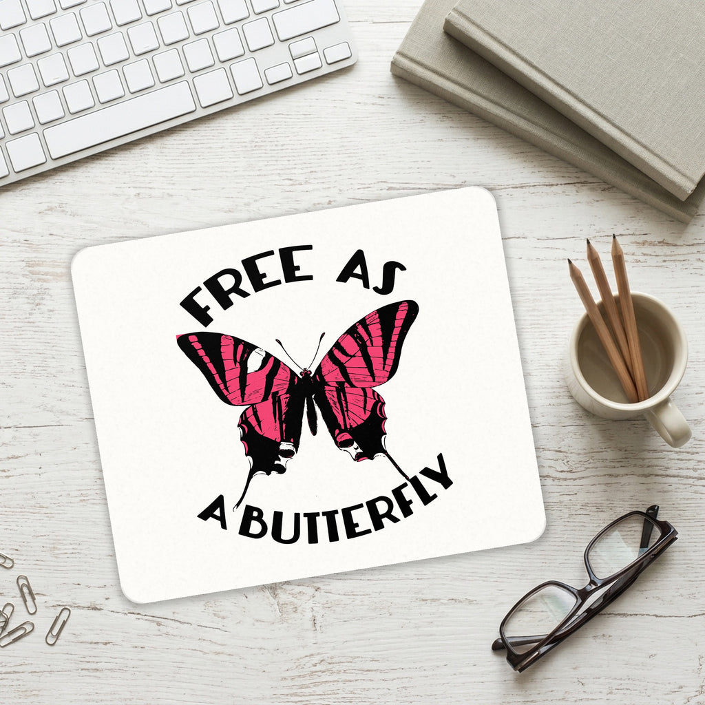 Free as a Butterfly - Pink mouse pad on a desk with a keyboard