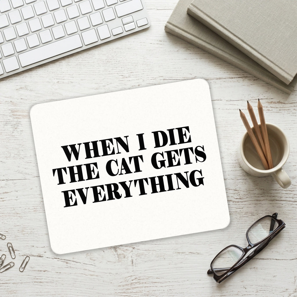 When I Die The Cat Gets Everything mouse pad on a desk with a keyboard