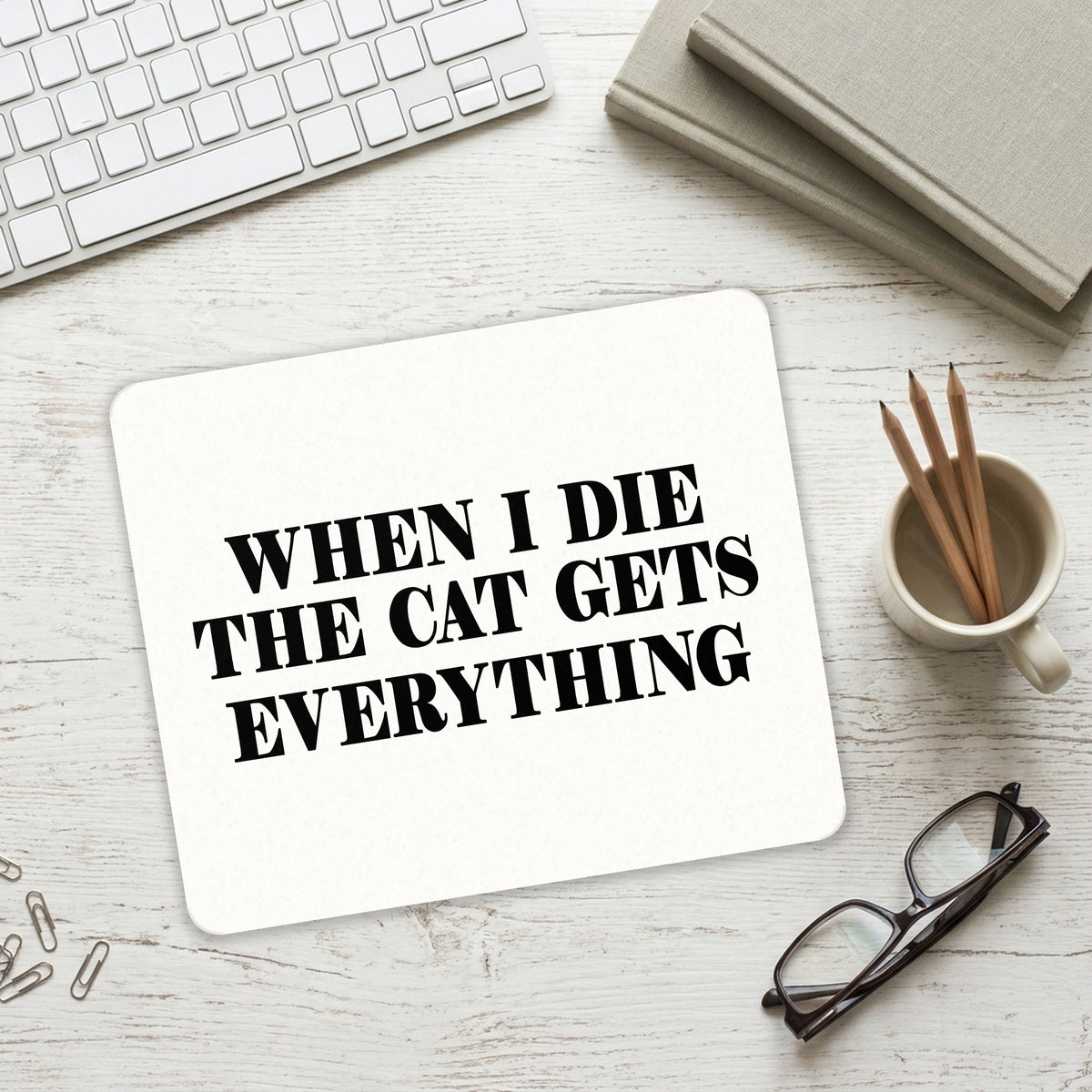 When I Die The Cat Gets Everything mouse pad on a desk with a keyboard