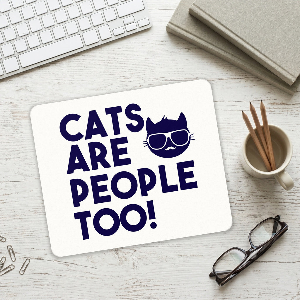 Cats Are People Too mouse pad on a desk with a keyboard