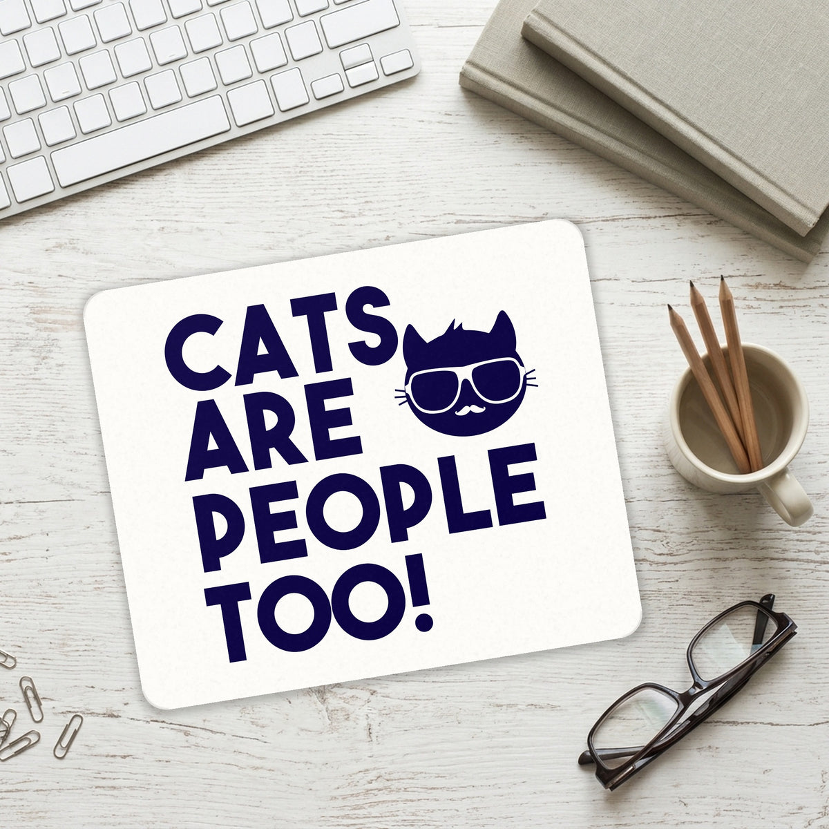 Cats Are People Too mouse pad on a desk with a keyboard