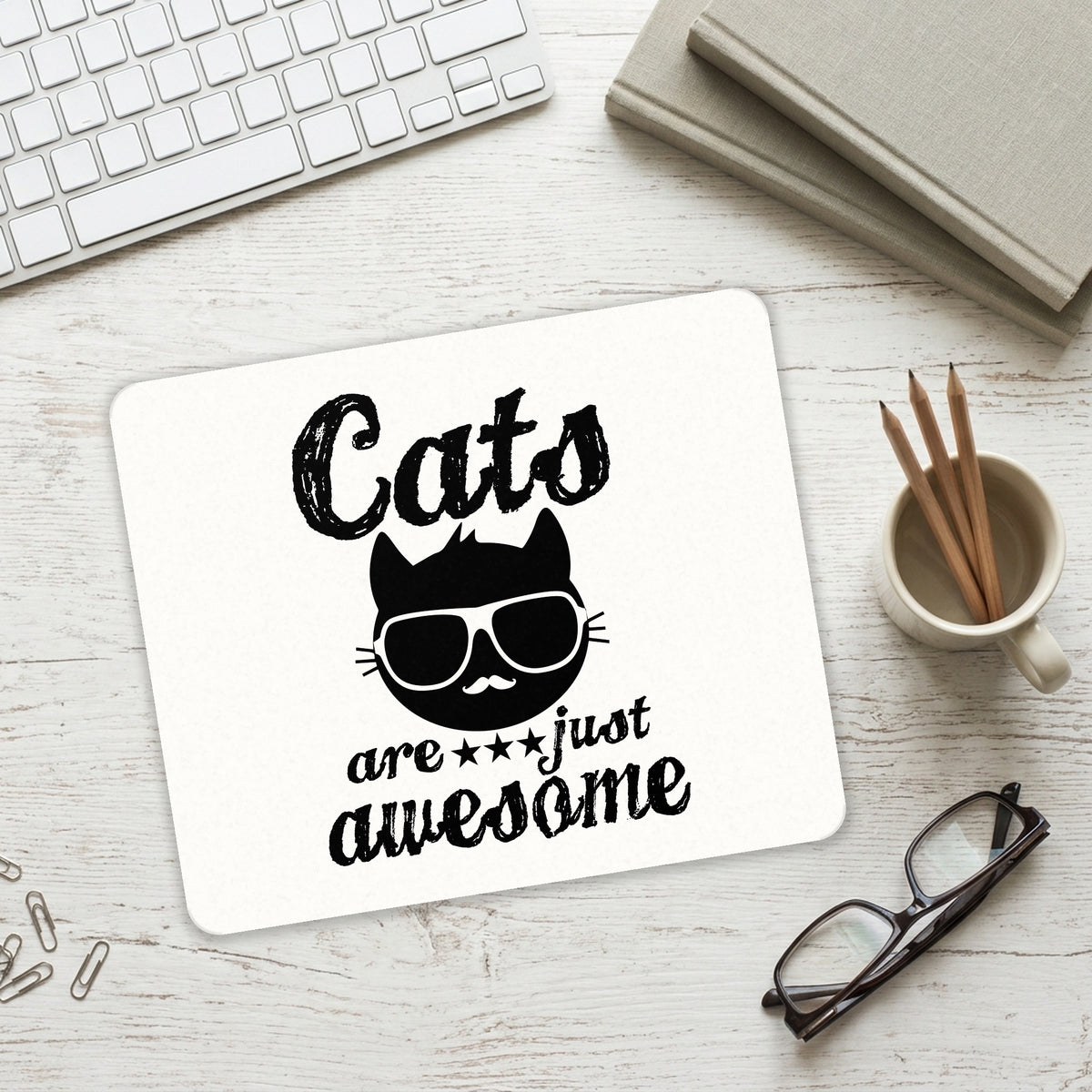 Cats Are Just Awesome mouse pad on a desk with a keyboard