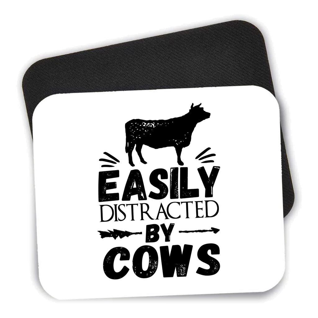 Easily Distracted By Cows mouse pad shown with its black non-slip rubber underside