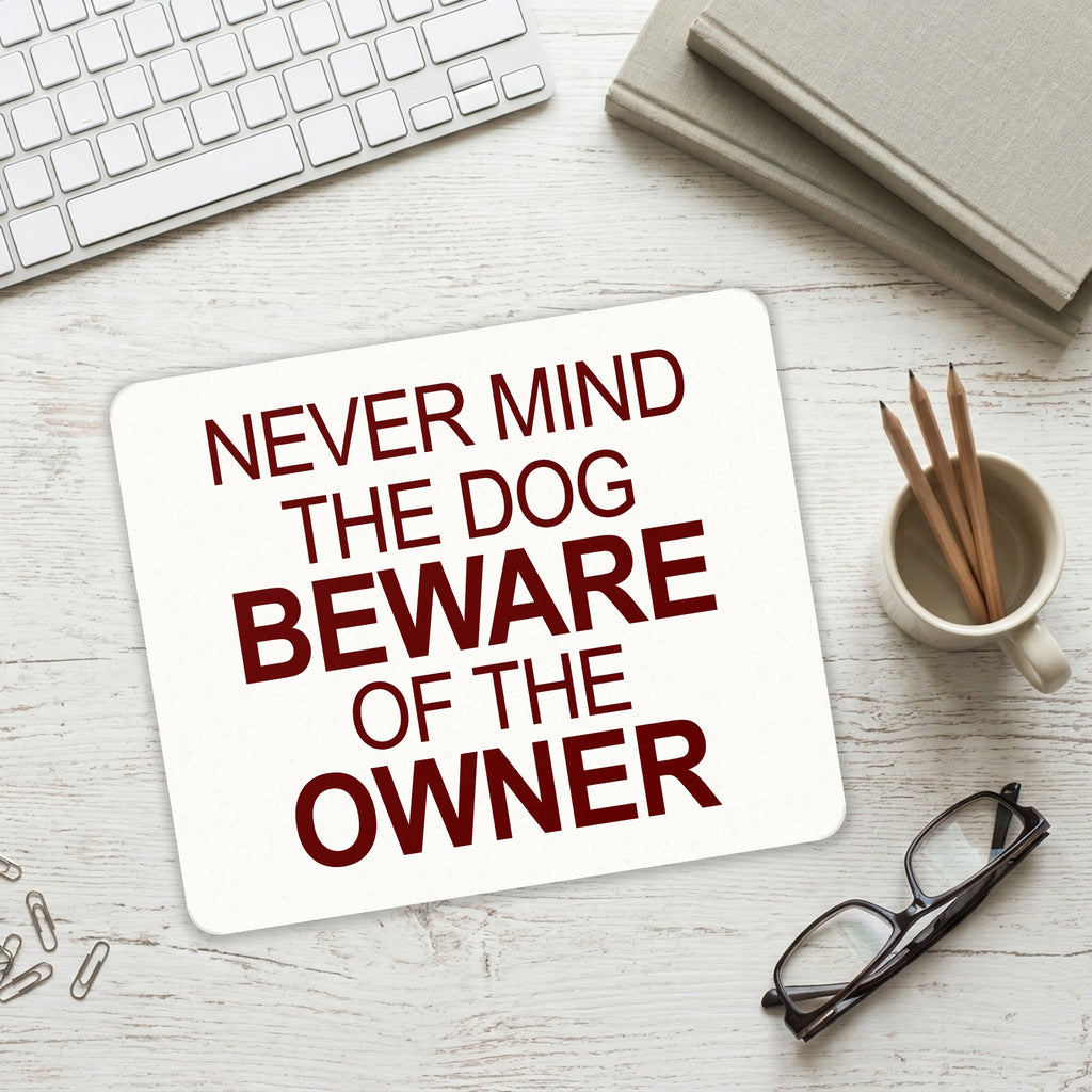 Never Mind the Dog, Beware the Owner mouse pad on a desk with a keyboard