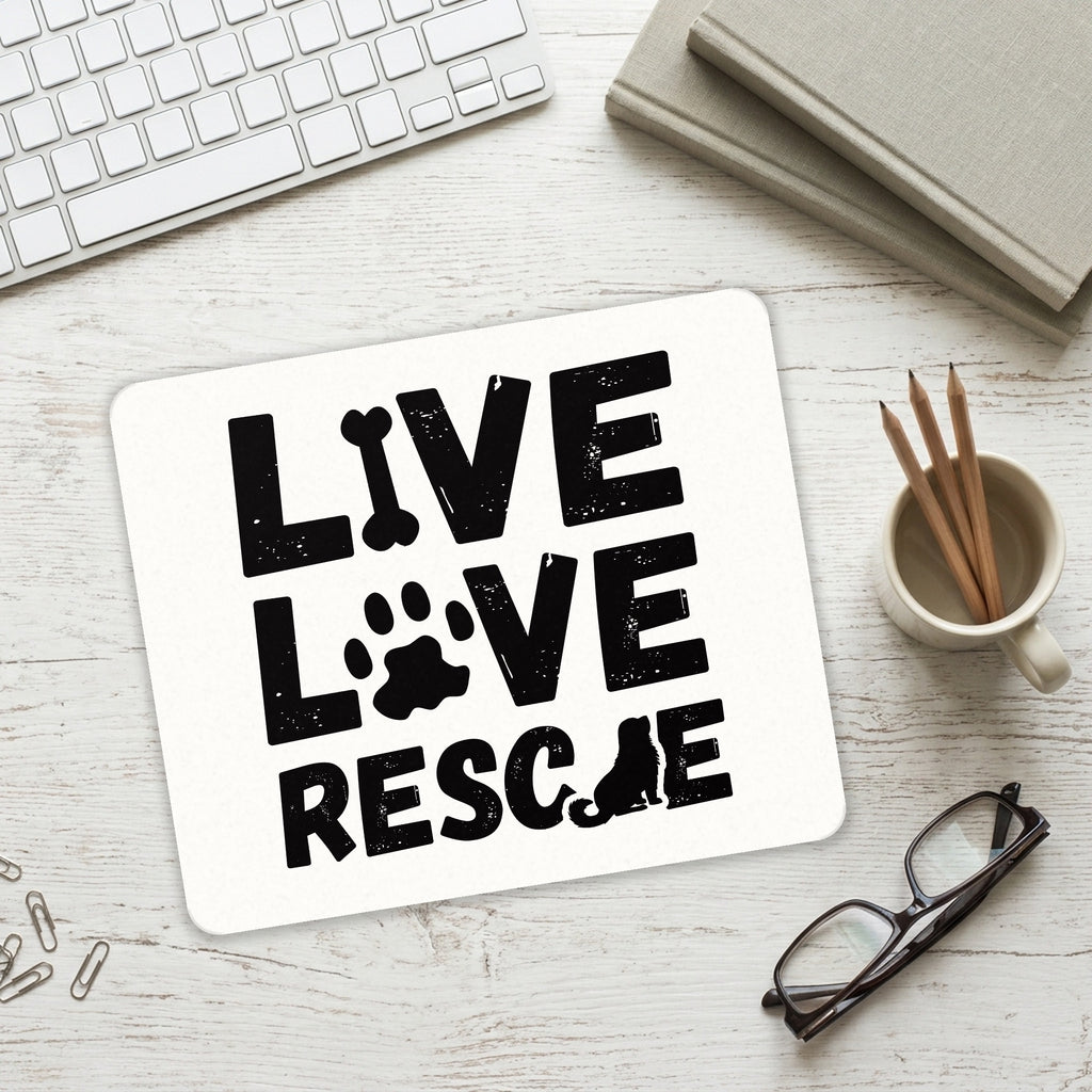 Live Love Rescue - Dog Paw mouse pad on a desk with a keyboard