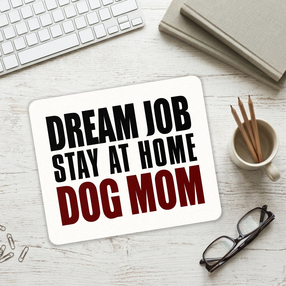Dream Job: Stay At Home Dog Mom mouse pad on a desk with a keyboard