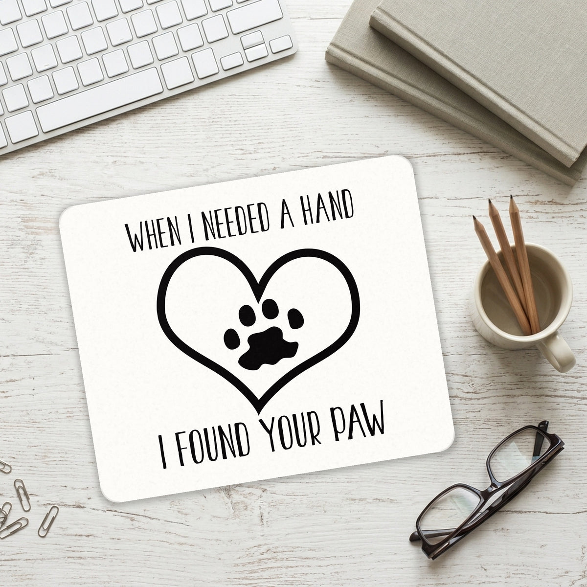 When I Need A Hand I Found Your Paw mouse pad on a desk with a keyboard