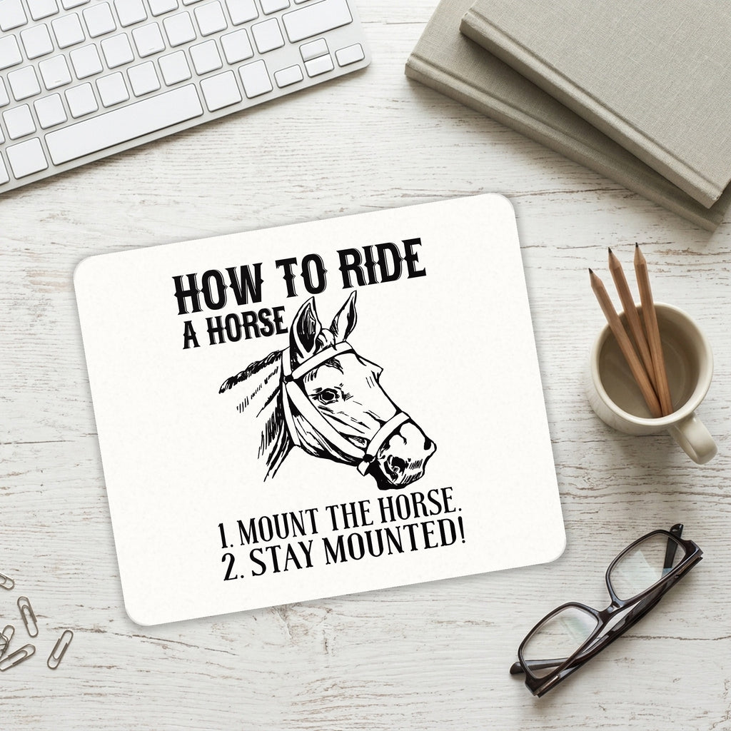 How To Ride a Horse - Stay Mounted mouse pad on a desk with a keyboard