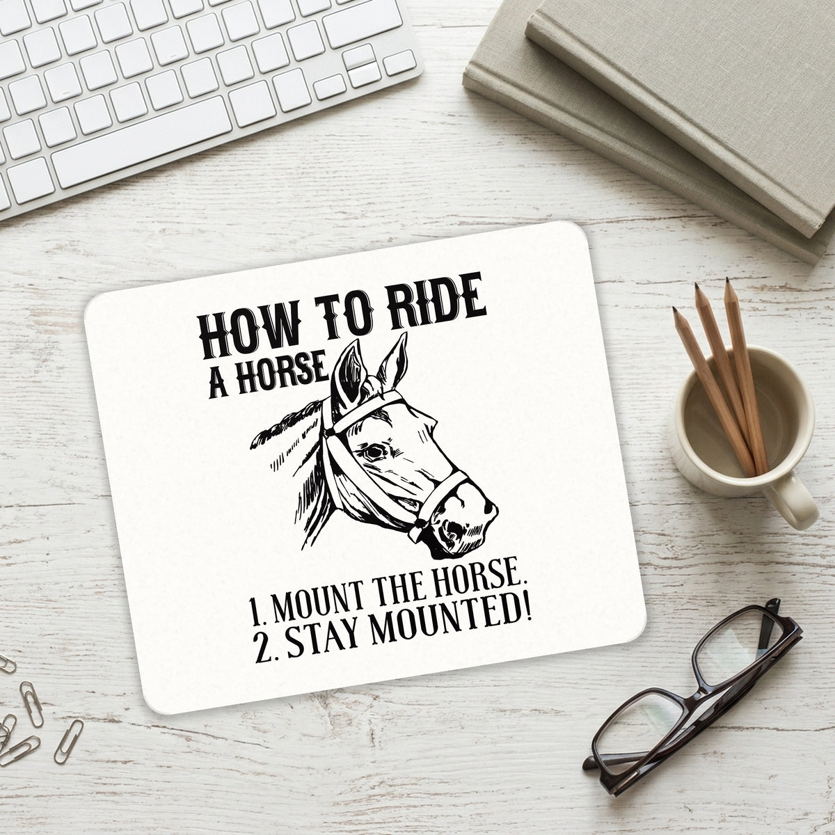How To Ride a Horse - Stay Mounted mouse pad on a desk with a keyboard