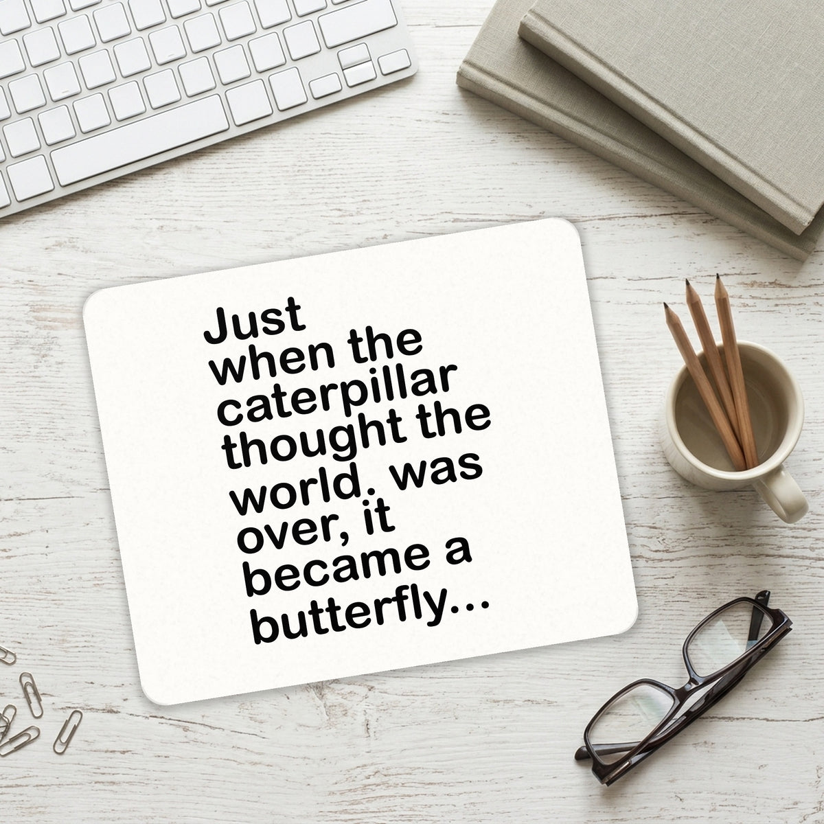 Caterpillar Though World Was Over Butterfly mouse pad on a desk with a keyboard