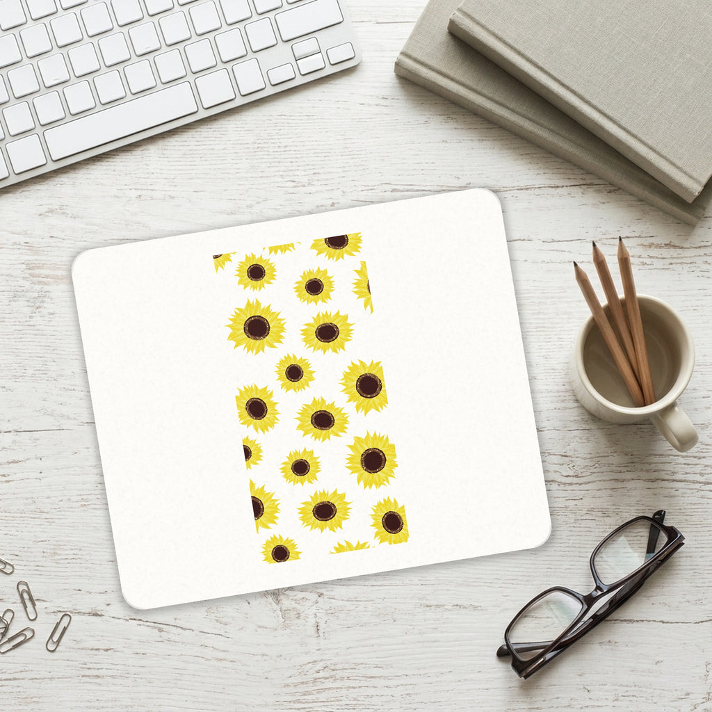 Yellow Sunflowers mouse pad on a desk with a keyboard