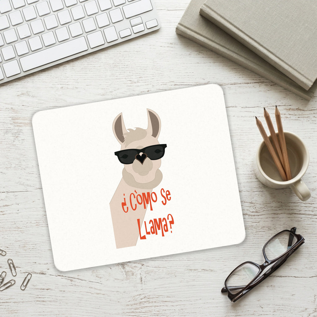 Cómo se Llama? mouse pad on a desk with a keyboard