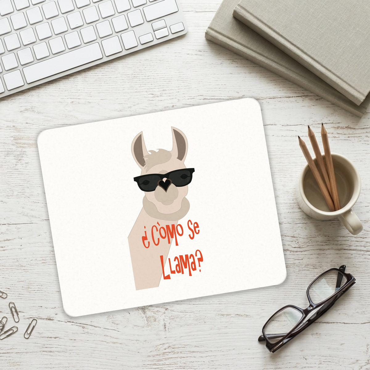 Cómo se Llama? mouse pad on a desk with a keyboard