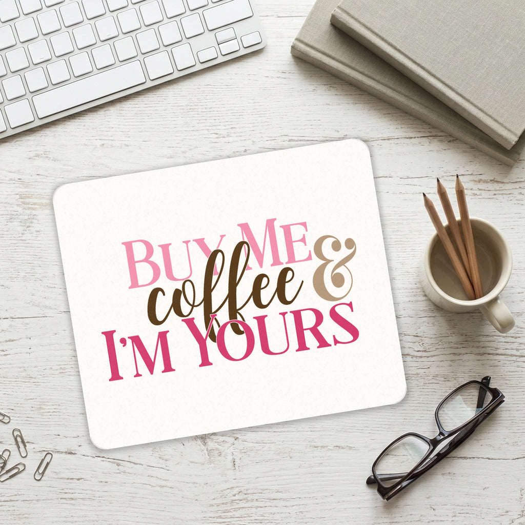 Buy Me Coffee & I'm Yours mouse pad on a desk with a keyboard