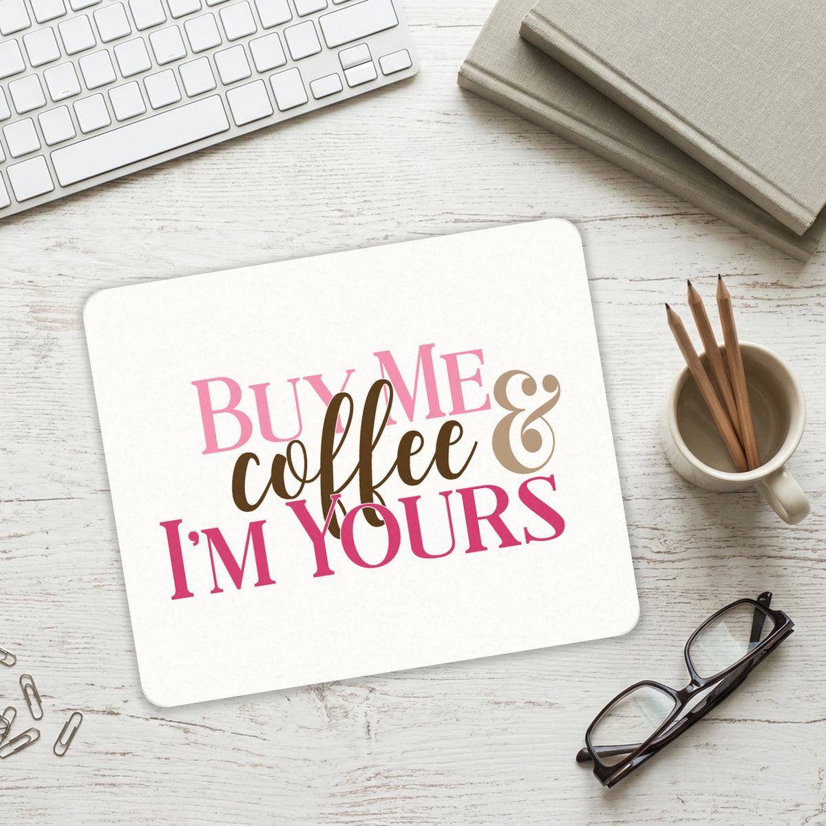 Buy Me Coffee & I'm Yours mouse pad on a desk with a keyboard