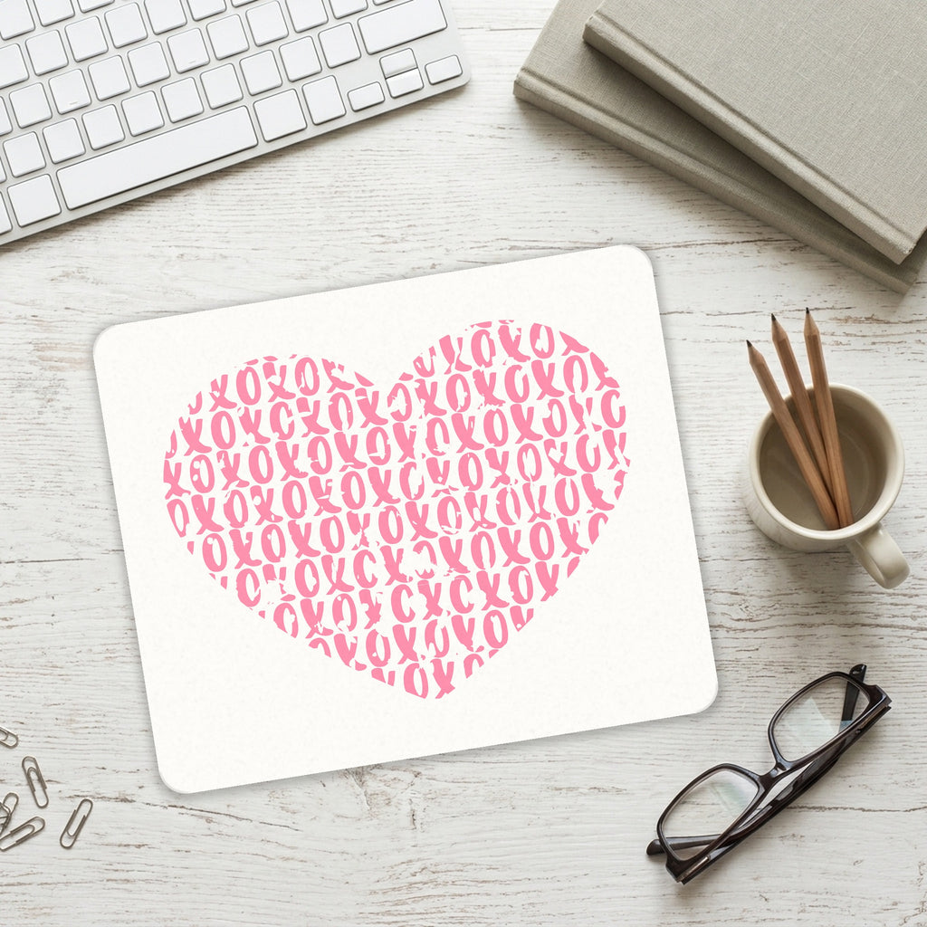 XOXO Heart Pink mouse pad on a desk with a keyboard