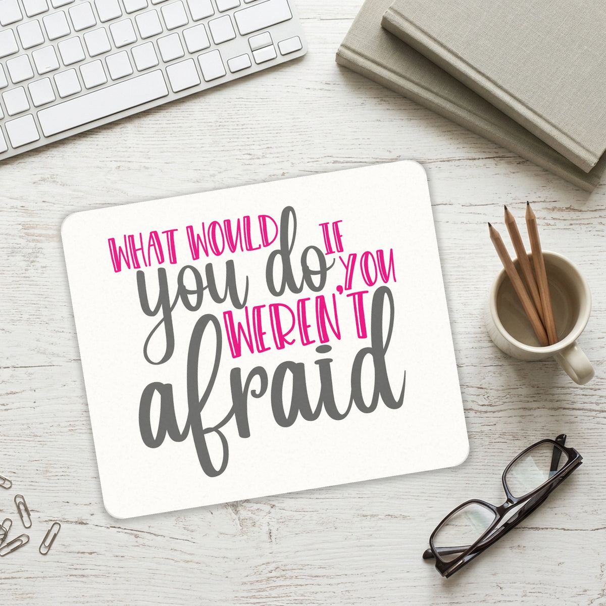 What Would You Do If You Weren't Afraid mouse pad on a desk with a keyboard