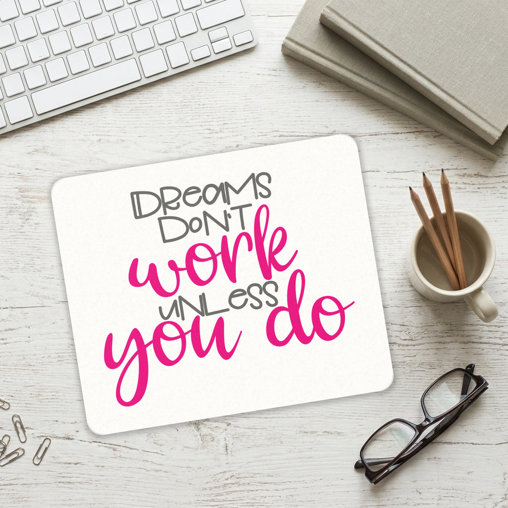 Dreams Don't Work Unless You Do mouse pad on a desk with a keyboard